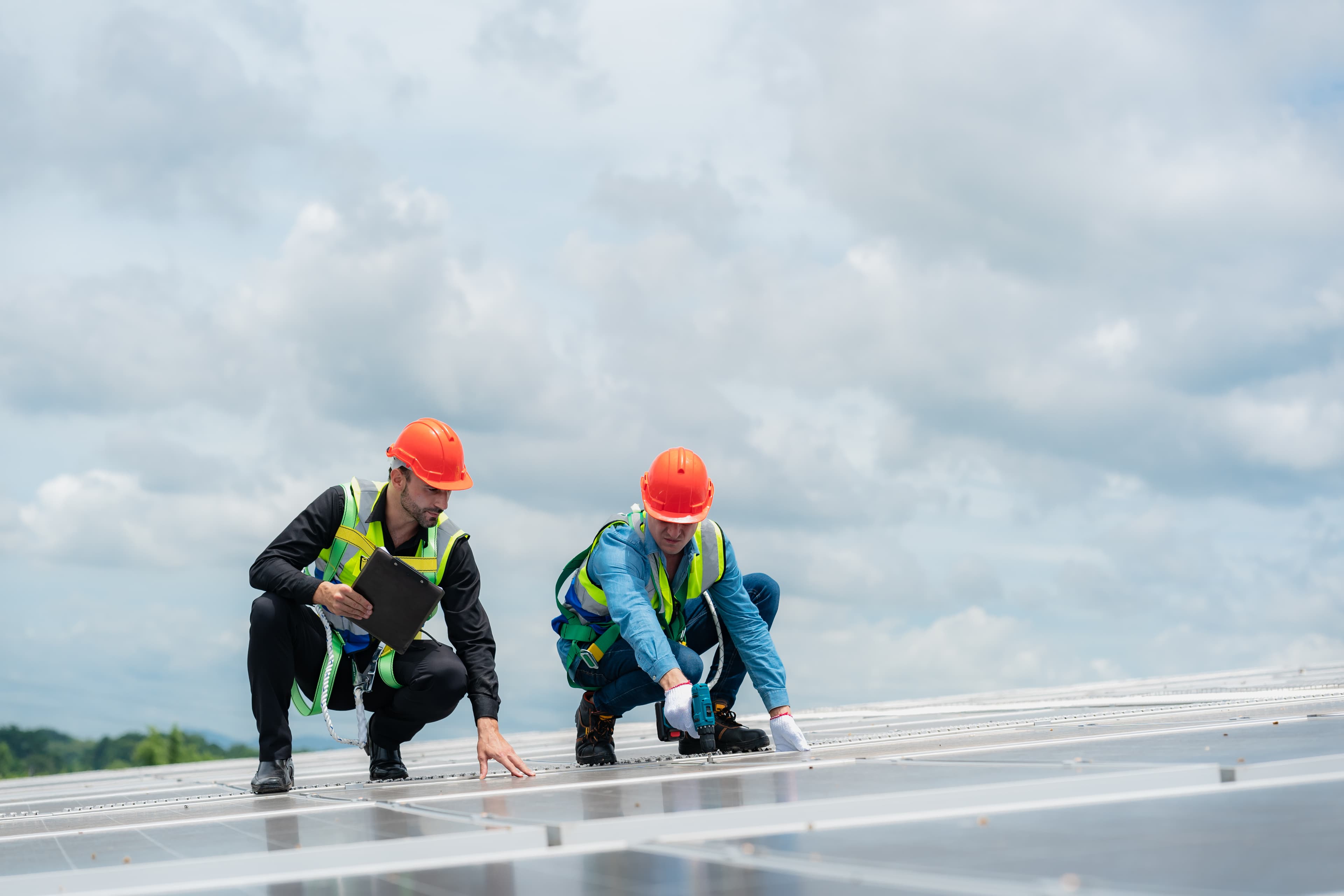 Licensed roof inspector checking roof surface condition in Tampa FL