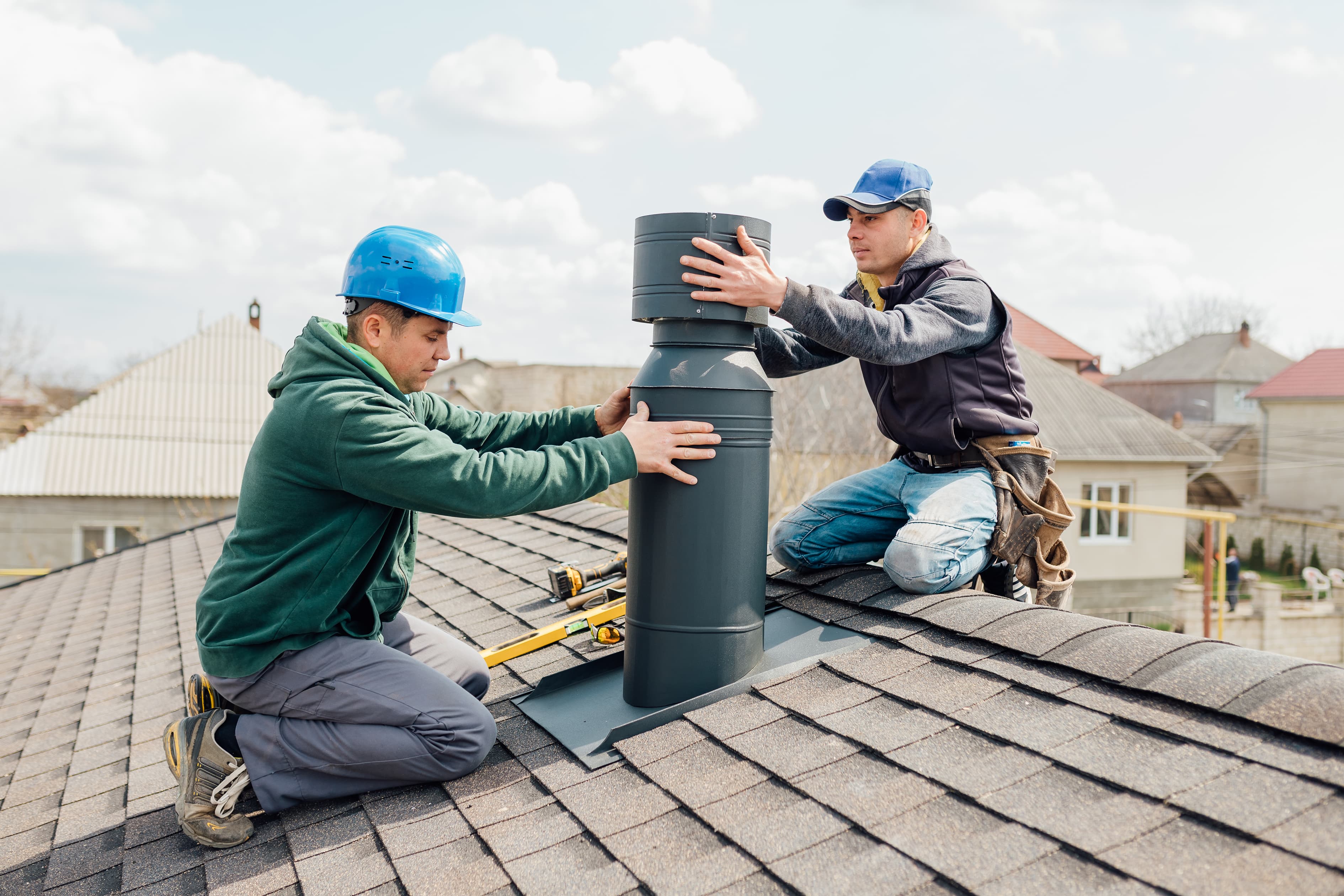 Roofing crew installing roof vent and waterproofing system in Tampa FL